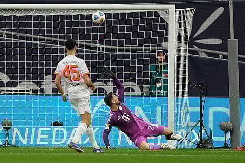 Bayern's goalkeeper Sven Ulreich fails to save the goal from Leverkusen's Aleix Garcia, unseen, during a German Bundesliga soccer match between Bayer Leverkusen and Bayern Munich in Leverkusen, Germany.