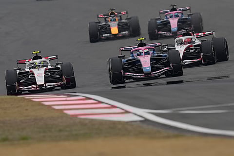 Haas driver Oliver Bearman of Britain, left, steers his car during the Chinese Formula One Grand Prix race at the Shanghai International Circuit
