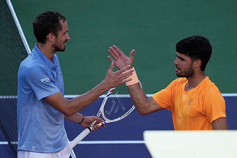 Daniil Medvedev, of Russia, left, is congratulated by Carlos Alcaraz, of Spain, after Medvedev defeated Alcaraz during a semifinal match at the BNP Paribas Open tennis tournament in Indian Wells, Calif.