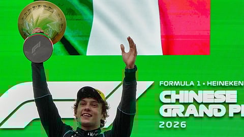 Kimi Antonelli celebrates after winning the Chinese Grand Prix.