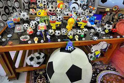 A display of football-themed memorabilia from the collection of former Rajasthan football team player Lalchand Agarwal at his residence, in Jaipur.