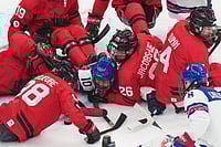| Photo: AP/Antonio Calanni : United States' Brett Bolton, center, challenges for the puck with Canada's Anton Jacobs-Webb during the ice hockey gold medal match between United States and Canada at the 2026 Winter Paralympics, in Milan, Italy.