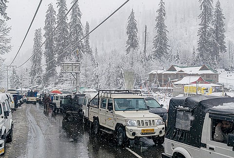 Vehicles stuck in a traffic jam during snowfall at Solang Valley, in Kullu district of Himachal Pradesh.