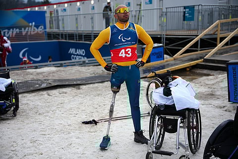 Robelson Lula, of Brazil, stands after competing in the cross country skiing men's 10Km interval start sitting final at the 2026 Winter Paralympics, in Tesero, Italy.