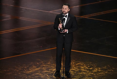 Andy Jurgensen accepts the award for film editing for "One Battle After Another" during the Oscars at the Dolby Theatre in Los Angeles. 