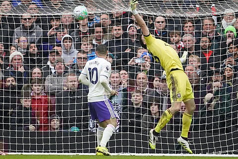 Aston Villa's goalkeeper Emiliano Martinez fails to save during the Premier League soccer match between Manchester United and Aston Villa in Manchester, England.