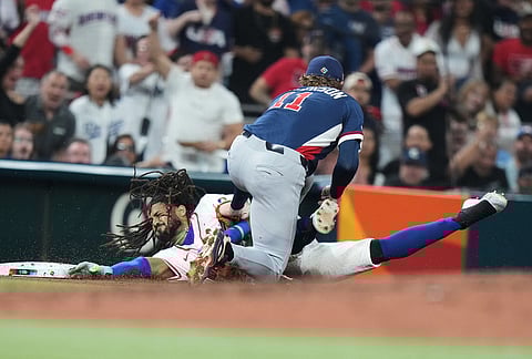 United States third baseman Gunnar Henderson (11) tags out Dominican Republic's Fernando Tatis Jr. during the third inning of a World Baseball Classic semifinal game in Miami.
