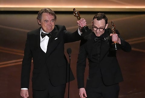 Maciek Szczerbowski, left, and Chris Lavis accept the award for animated short film for "The Girl Who Cried Pearls" during the Oscars at the Dolby Theatre in Los Angeles.