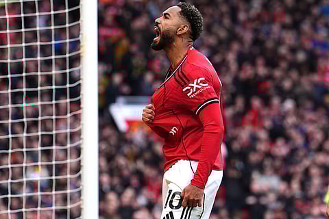Manchester United's Matheus Cunha celebrates scoring their side's second goal of the game during the Premier League match between Manchester United and Aston Villa, in Manchester, England.