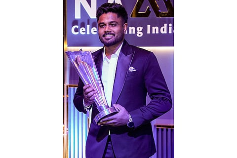 Indian men's cricket team player Sanju Samson with a trophy during the BCCI Naman Awards 2026, in New Delhi.