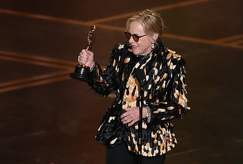 Amy Madigan accepts the award for actress in a supporting role for "Weapons" during the Oscars at the Dolby Theatre in Los Angeles.