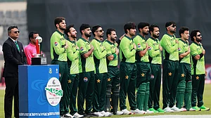 (AP Photo/Mahmud Hossain Opu) : Pakistan's players stand up for the national anthem before the start of the first one day international cricket match between Bangladesh and Pakistan in Mirpur, Bangladesh, Wednesday, March 11, 2026.