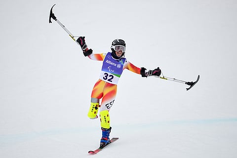 Maria Martin-Granizo, of Spain, crosses the finish line on her second run of the alpine skiing women's giant slalom standing at the 2026 Winter Paralympics, in Cortina d'Ampezzo, Italy.