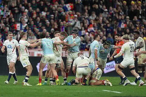 Players clash during the Six Nations rugby union match between France and England in Saint-Denis, outside Paris.