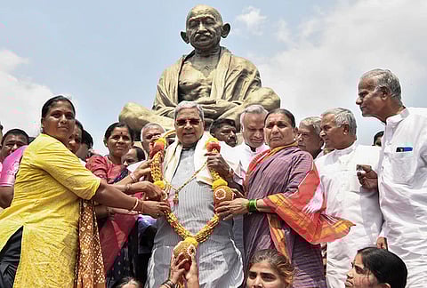 Karnataka Chief Minister Siddaramaiah after being felicitated near the Gandhi statue, Vidhana Soudha. 