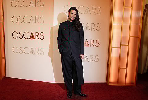 Oliver Laxe arrives at the Oscars at the Dolby Theatre in Los Angeles. 