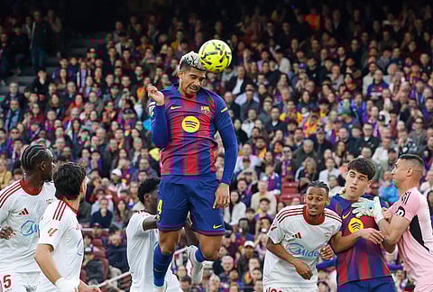 Barcelona's Ronald Araujo makes an attempt to score during the Spanish La Liga soccer match between Barcelona and Sevilla in Barcelona, Spain.
