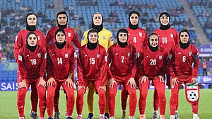 (Dave Hunt/AAPImage via AP,File) : FILE - Iran players pose for a team photo ahead of the Women's Asian Cup soccer match between Iran and the Philippines in Robina, Australia, Sunday, March 8, 2026.