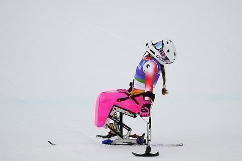 Audrey Pascual Seco, of Spain, reacts after crossing the finish line in the to win the bronze medal in the alpine skiing women's giant slalom sitting at the 2026 Winter Paralympics, in Cortina d'Ampezzo, Italy.