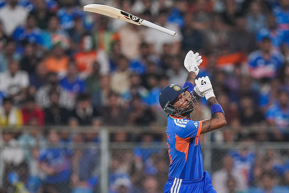 India's Hardik Pandya loses his grip on the bat during the ICC Men's T20 World Cup 2026 second semifinal cricket match between India and England at Wankhede Stadium, in Mumbai. - | Photo: PTI/Kunal Patil