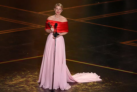 Jessie Buckley accepts the award for actress in a leading role for "Hamnet" during the Oscars at the Dolby Theatre in Los Angeles. 