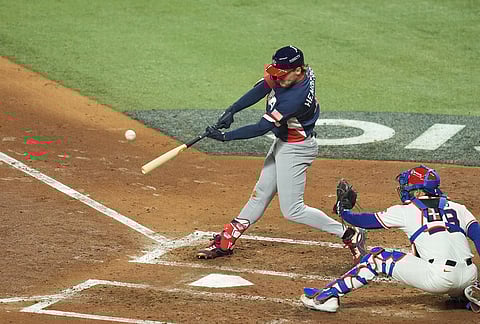 United States' Gunnar Henderson hits a home run during the fourth inning of a World Baseball Classic semifinal game against the Dominican Republic in Miami. 