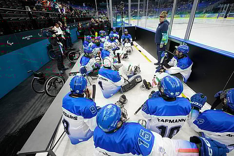 Italian players get ready prior to the Group A hockey match between Italy and China at the 2026 Winter Paralympics, in Milan, Italy.