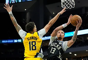 | Photo: AP/Aaron Gash : Milwaukee Bucks' Ryan Rollins (13) shoots against Indiana Pacers' Jalen Slawson (18) during the second half of an NBA basketball game in Milwaukee.