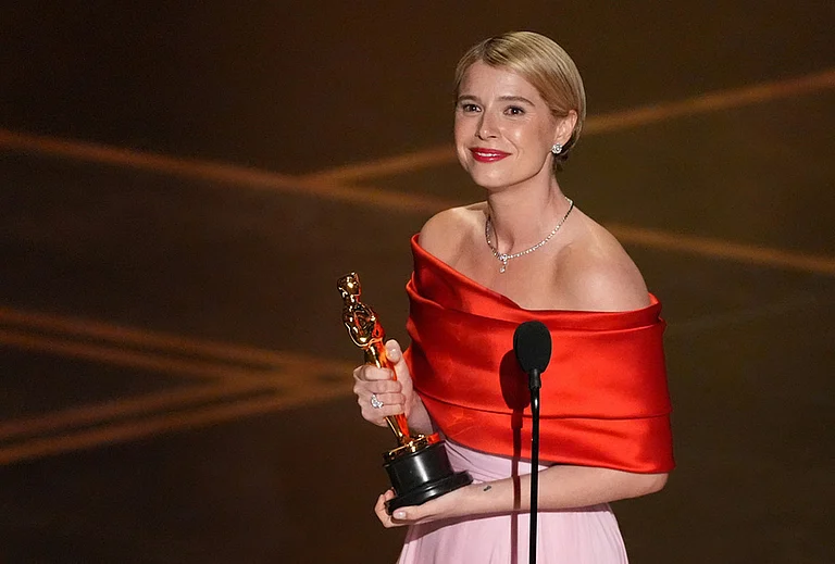 Jessie Buckley accepts the award for actress in a leading role for "Hamnet" during the Oscars at the Dolby Theatre in Los Angeles. - | Photo: AP/Chris Pizzello