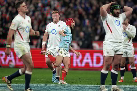 Louis Bielle‑Biarrey of France celebrates after Thomas Ramos kicked the winning penalty during the Six Nations rugby union match between France and England in Saint-Denis, outside Paris.