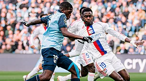 | Photo: X/HAC_Foot : Le Havre's Lucas Gourna-Douath tussles with the ball with Lyon's Moussa Niakhite during their Ligue 1 match on March 15, 2026.