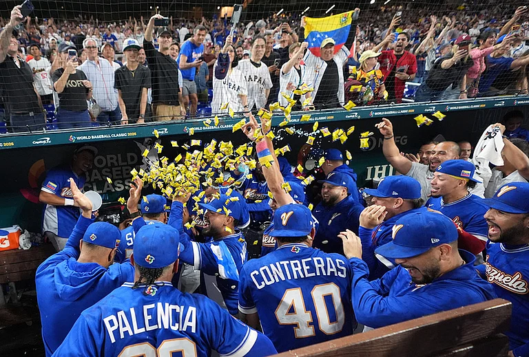 Venezuela team celebrate their victory over Japan after a World Baseball Classic quarterfinal game in Miami. - | Photo: AP/Lynne Sladky