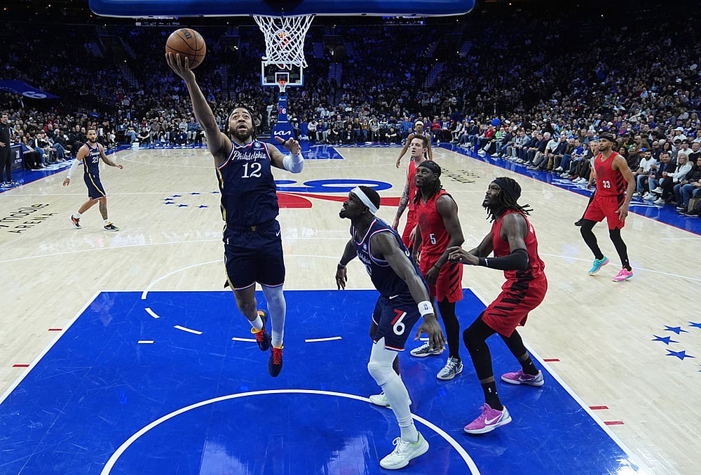 Philadelphia 76ers' Trendon Watford (12) goes up to shoot during the first half of an NBA basketball game against the Portland Trail Blazers in Philadelphia.  - | Photo: AP/Matt Rourke