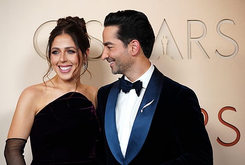 Natalie Qasabian, left, and Sev Ohanian arrive at the Oscars at the Dolby Theatre in Los Angeles. 