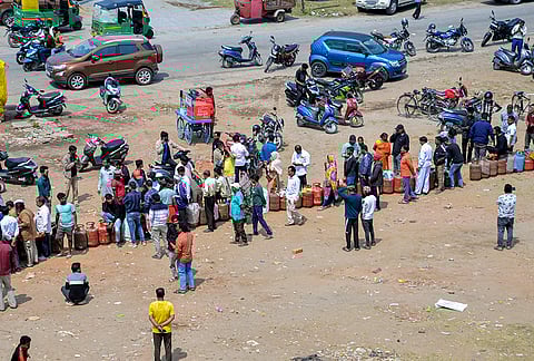 People gather to avail LPG cooking gas cylinders amid a shortage linked to the ongoing West Asia conflict affecting the global energy supply chain, in Ranchi.