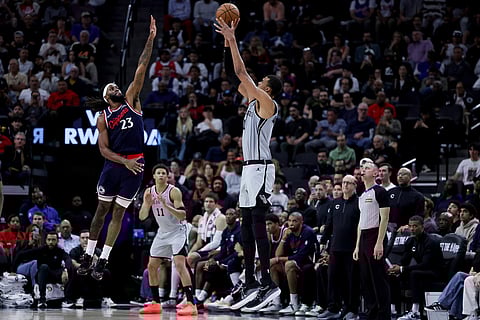 San Antonio Spurs forward Victor Wembanyama, right, shoots against Los Angeles Clippers forward Isaiah Jackson during the second half of an NBA basketball game in Inglewood, Calif.