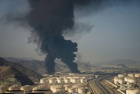Fire and plumes of smoke rise from an oil facility in Fujairah, United Arab Emirates, Saturday, March 14, 2026. 