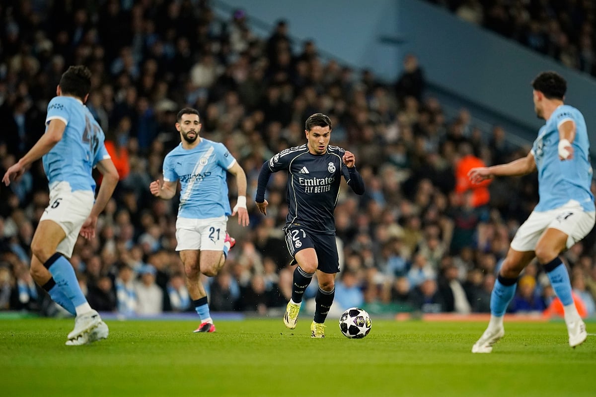 Real Madrid's Diego Aguado runs with the ball during the Champions League round of 16 second leg soccer match between Manchester City and Real Madrid in Manchester.