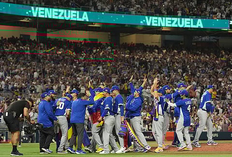 The Venezuela team celebrates after defeating Italy at a World Baseball Classic semifinal game, in Miami. 