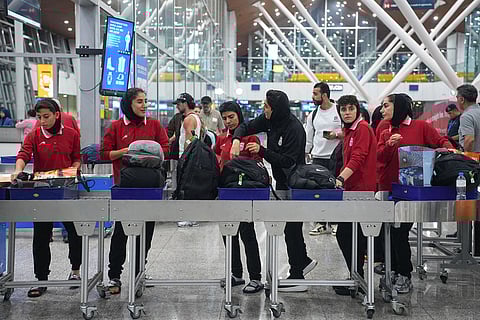 Members of Iran's women's football team arrive at the Kuala Lumpur International Airport in Sepang, Malaysia.