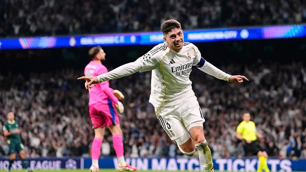 Real Madrid's Federico Valverde celebrates after scoring during a first leg round of 16 Champions League soccer match between Real Madrid and Manchester City in Madrid, Spain. - | Photo: AP/Jose Breton