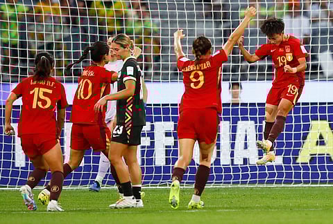 China's Zhang Linyan, right, celebrates after scoring her team's fourth goal from a penalty during the Women's Asian Cup semifinal soccer match between China and Australia in Perth, Australia.