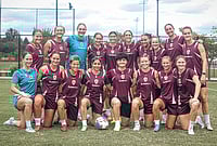 | Photo: Brisbane Roar via AP : Iranian soccer player's Fatemeh Pasandideh, fourth from right at front row, and Atefeh Ramezanisadeh, fourth from left at front row, pose for a photo with the Brisbane Roar women's A-League team at a training session in Brisbane, Australia.