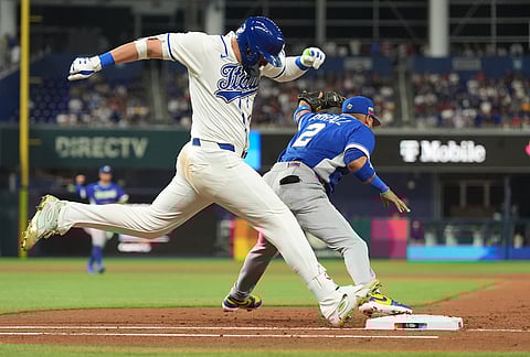 Venezuela first baseman Luis Arraez (2) catches the ball as Italy Vinnie Pasquantino is out on first base during the second inning of a World Baseball Classic semifinal game in Miami.
