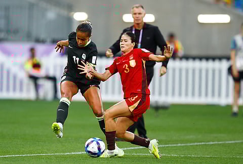 Australia's Mary Fowler, left, and China's Chen Qiaozhu battle for the ball during the Women's Asian Cup semifinal soccer match between China and Australia in Perth, Australia.