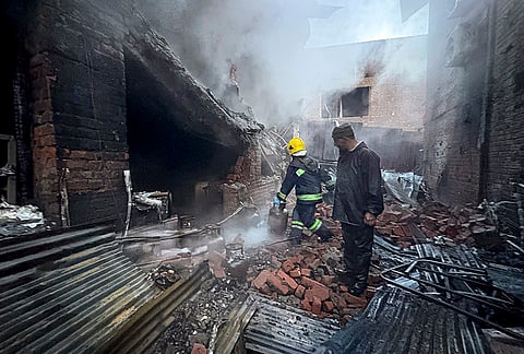 Fire and Emergency Services personnel attempt to douse a blaze that broke out at a hotel, in Pahalgam, Anantnag district, Jammu and Kashmir.