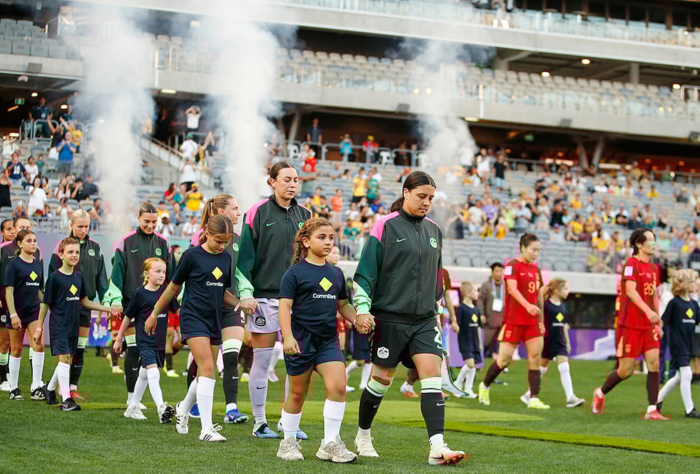 Australia's Sam Kerr leads her team onto the field ahead of the Women's Asian Cup semifinal soccer match between China and Australia in Perth, Australia. - | Photo: AP/Gary Day