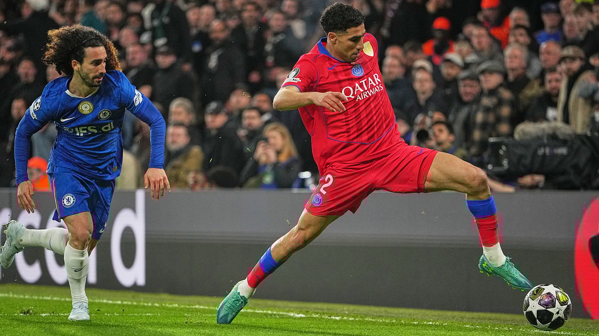 Chelsea's Marc Cucurella, left, and PSG's Achraf Hakimi in action during the Champions League soccer match between Chelsea and Paris Saint-Germain - AP/Kin Cheung