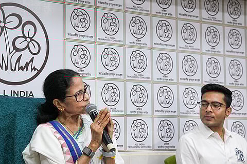 West Bengal Chief Minister Mamata Banerjee releases the TMC candidate list for the upcoming 2026 Assembly elections at her Kalighat residence, in Kolkata. TMC MP Abhishek Banerjee is also seen.
