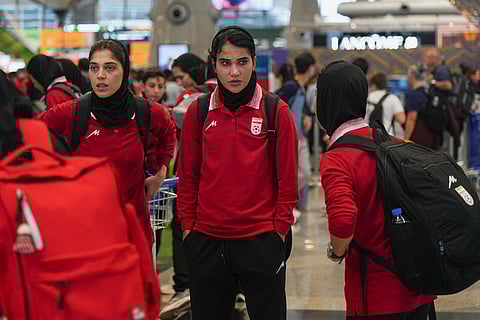 Members of Iran's women's football team arrive at the Kuala Lumpur International Airport in Sepang, Malaysia.